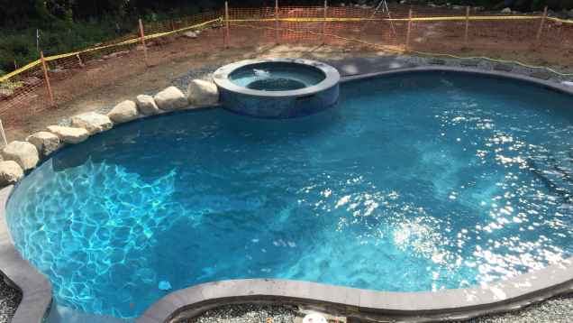 After installation. The pool includes a built-in circle hot tub.