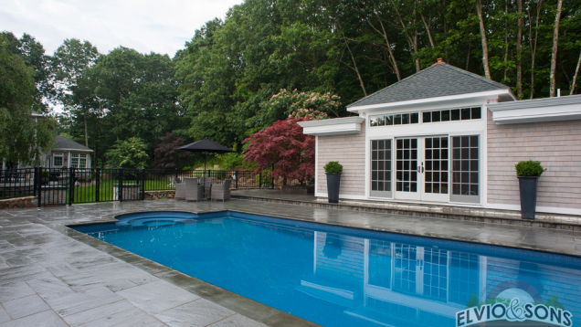 Blue stone patio and in-ground pool in North Kingston, RI.