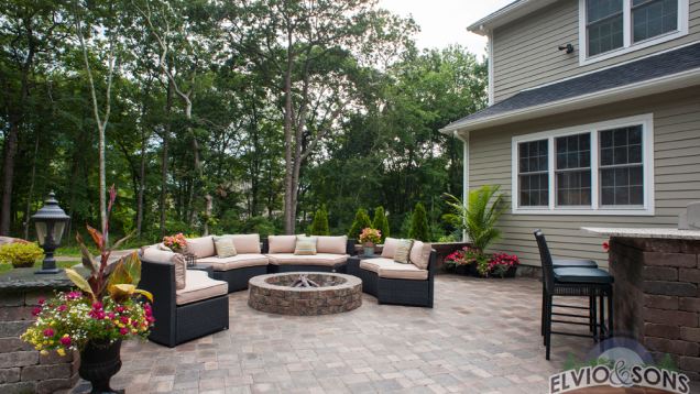 Built-in fire place on paver patio.