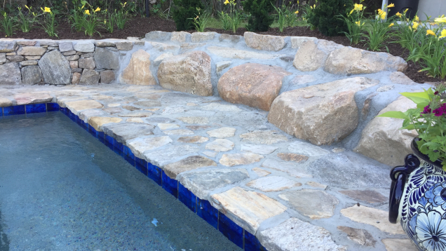 Custom in-ground gunite spa and natural stone work.