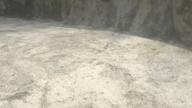 In-progress gunite pool restoration. A new plaster finish and 6" tile has been applied.